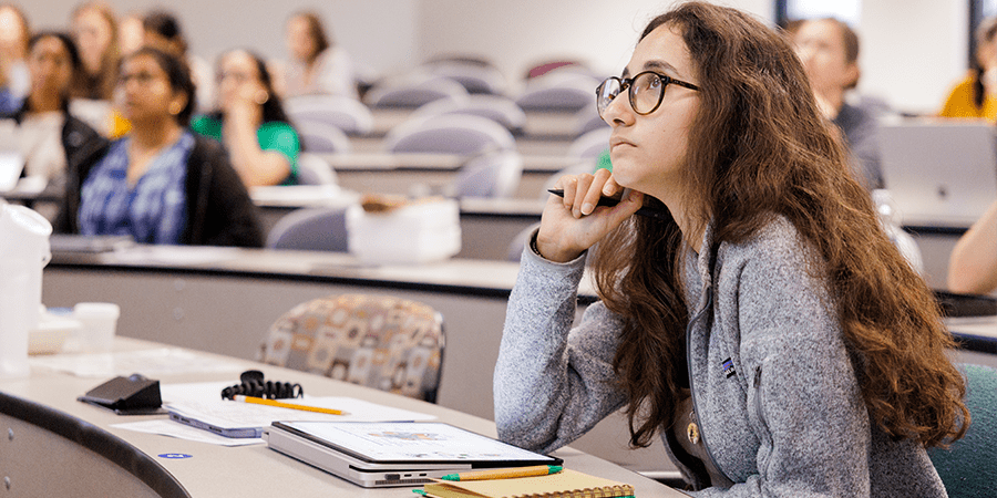 Female student sitting in a university classroom