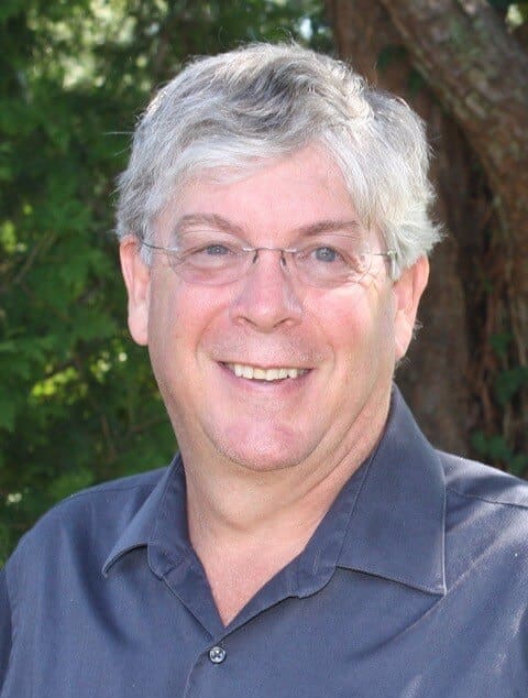 Dr. Craig Yencho, smiling with trees in the background