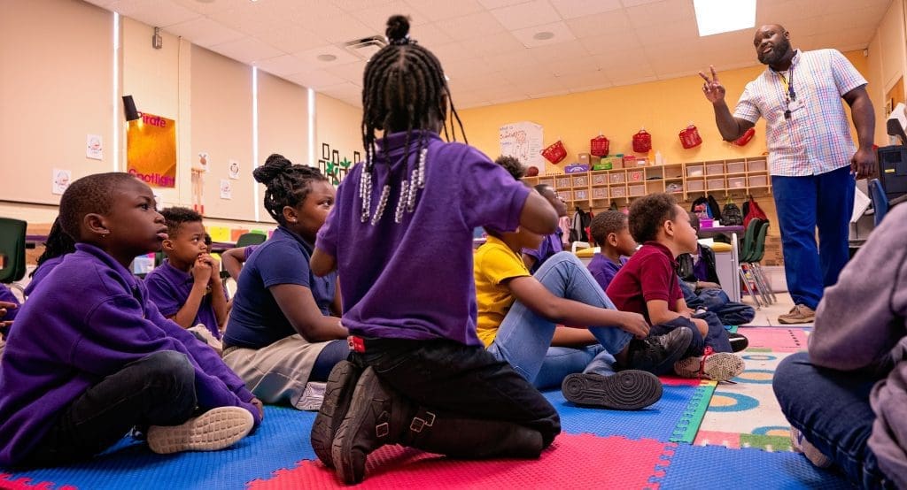 Elementary school students in a colorful classroom at the ECU Community School on Howell Street.