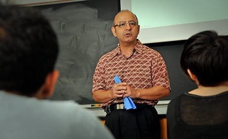 Dr. Behnam Pourdeyhimi teaching students in a classroom