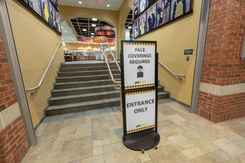 Signs direct foot traffic to move in one direction